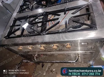 The burner top and controls of the commercial gas cooker, January 2022