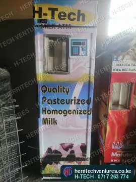 An H-TECH milk ATM selling pasteurized milk next to a cooking oil ATM in a customer's shop, September 2021