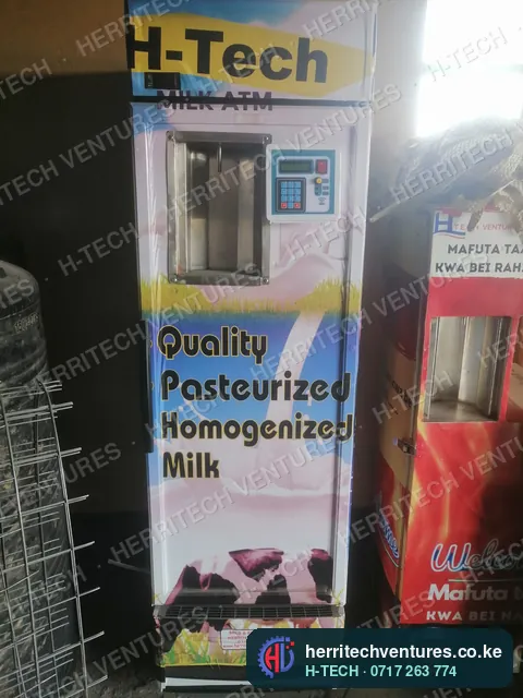 An H-TECH milk ATM selling pasteurized milk next to a cooking oil ATM in a customer's shop, September 2021