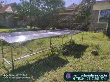 Long stainless steel work tables for a commercial kitchen, January 2022