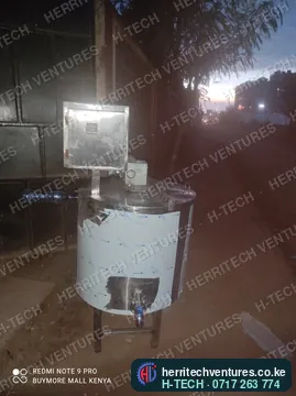 An H-TECH batch milk pasteurizer: jacketed stainless vat, stirrer motor, outlet valve and control box, March 2022