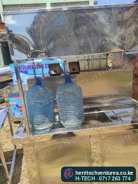 A stainless refill counter with 20 L bottles, September 2024