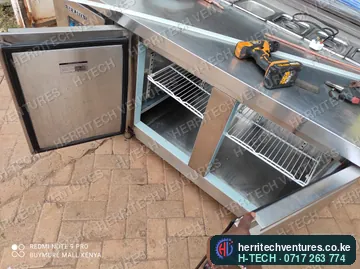 A stainless steel refrigerated counter under fabrication, April 2022