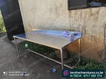 A stainless steel work table with a back upstand, made in our workshop, January 2022
