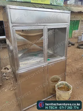 A stainless cabinet with glass doors, February 2023