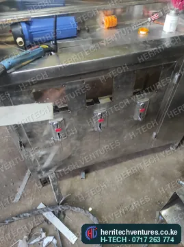 A stainless water refill counter with filters and taps, March 2023