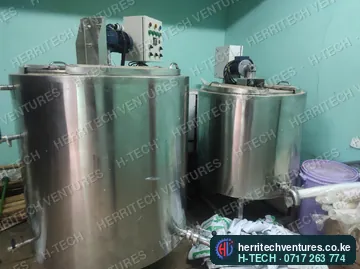 Two milk pasteurizers installed in a dairy room, July 2023