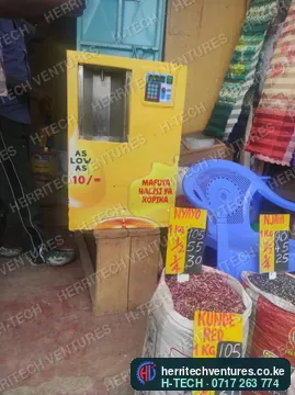 A yellow cooking oil ATM selling in a market shop, May 2022